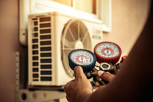 Professional Heat Pump Repair technician working in Lakewood, NY